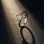 Silver ring on a dark surface with a spotlight effect