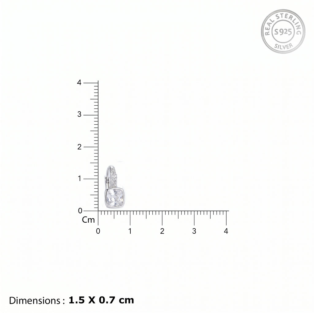 Heart-shaped silver pendant with measurement scale on a white background